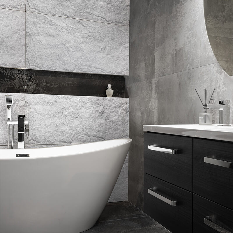 Polyurethane faux stone panels installed on an bathroom wall.