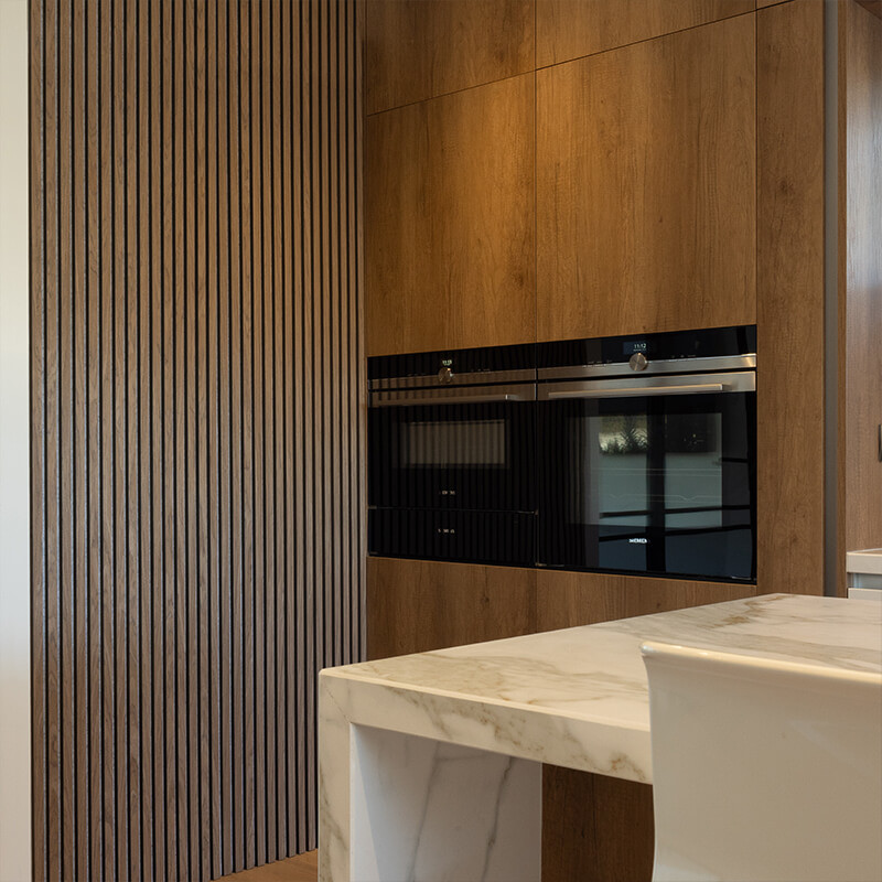 Modern kitchen wall panels in a bright, open-plan layout