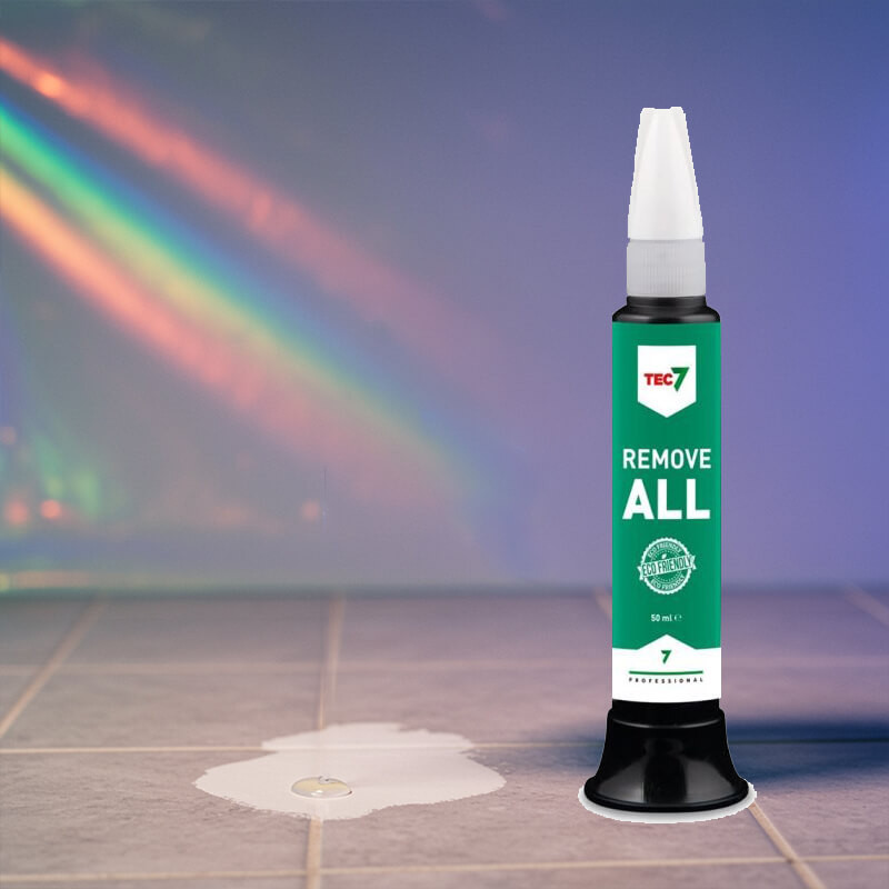 Tec7 Remove All 50ml tile paint remover placed on tiles with a small paint stain.