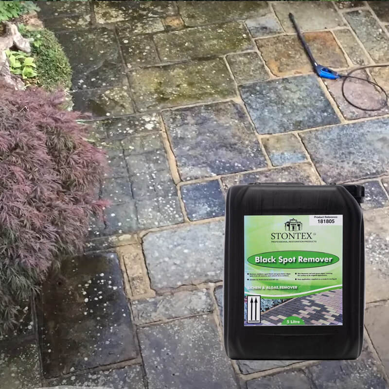Stontex Patio Black Spot Remover in action to remove lichen, moss and algae on patio slabs, mainly sandstone patio slabs.