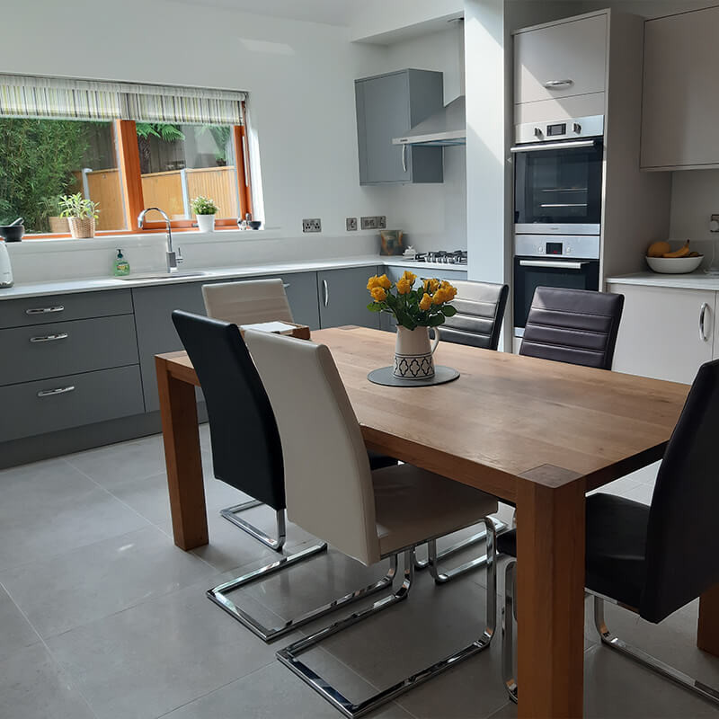 Kitchen decision: Durable laminate flooring in a modern kitchen with stainless steel appliances.