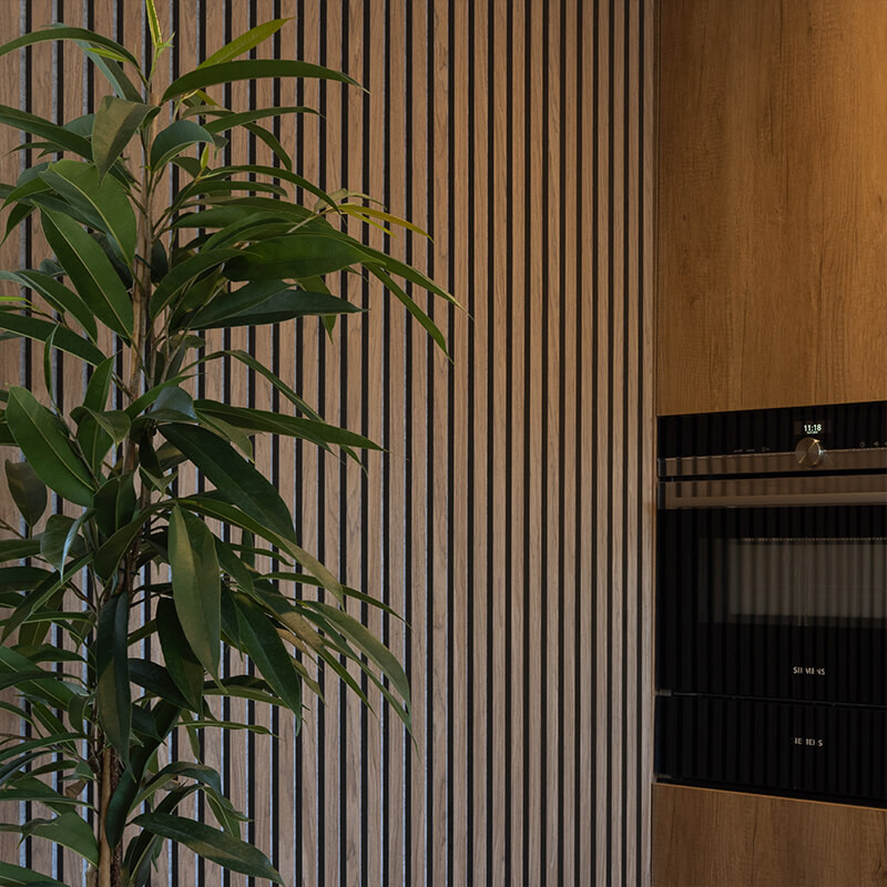 Kitchen feature wall with elegant timber cladding