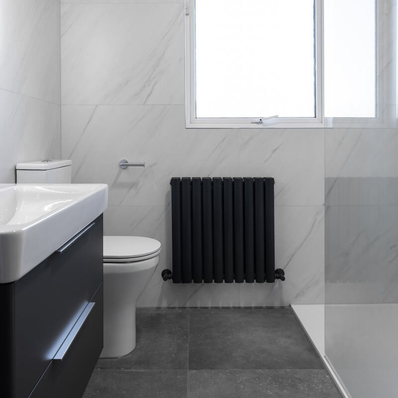 Modern small bathroom featuring large-format floor tiles
