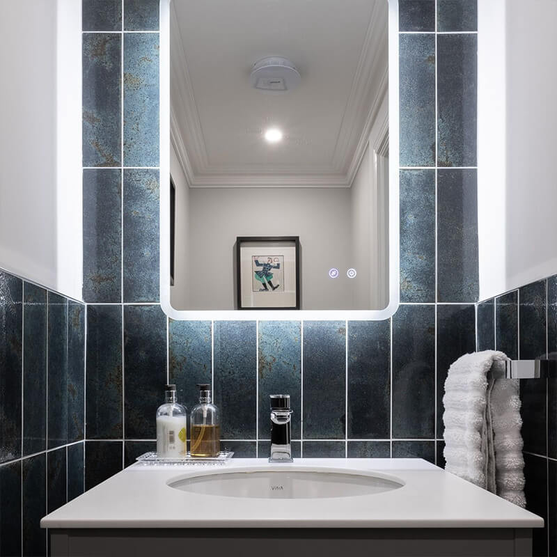 Small bathroom with bold patterned wall tiles