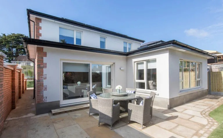 A clean patio featuring natural paving slabs