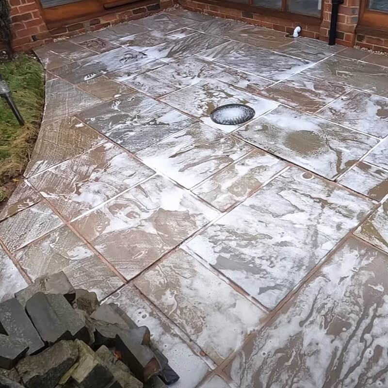 Outdoor space with moss and algae in preparation to be cleaner using Stontex Black Spot Remover