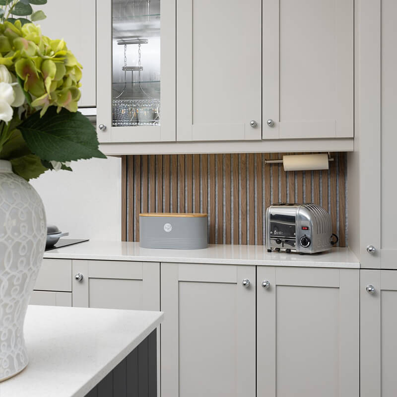 Textured wall panelling in a modern kitchen with island