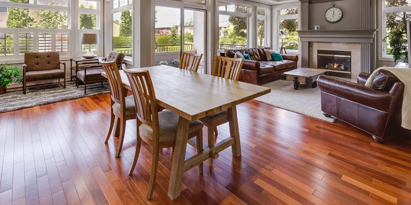 Modern light oak laminate wood flooring with an AC4 durability rating installed in a contemporary Dublin living room, showcasing moisture-resistant properties suited for the Irish climate