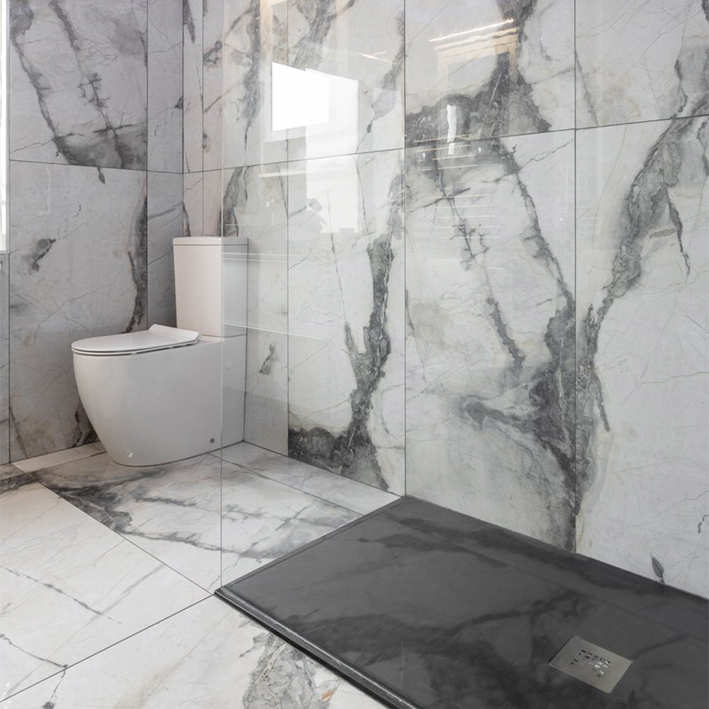 Using large tiles or extra-large-format tiles in a bathroom is a great way to quickly and dramatically improve its look and feel. 