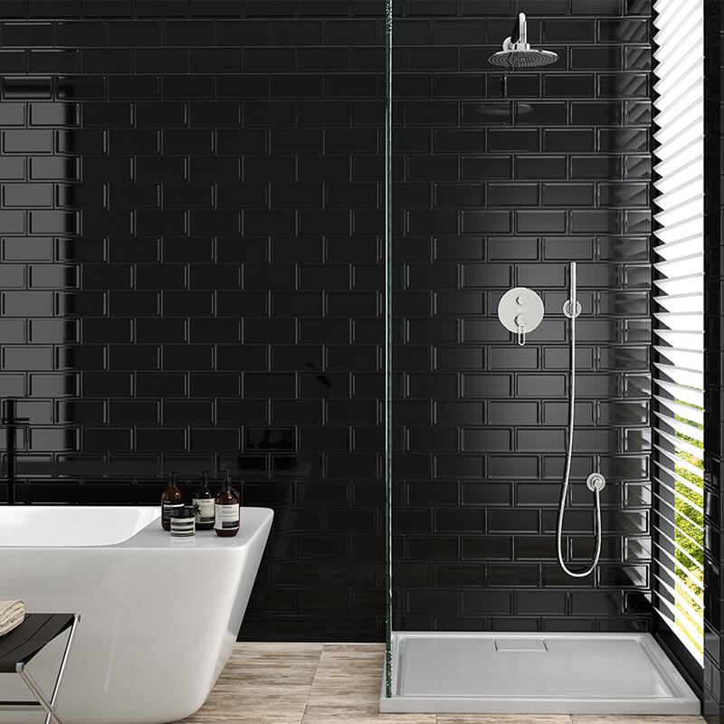 Dark Feature Wall Wet Room Design Black subway tiles in a walk-in wet room shower with a dark accent wall.