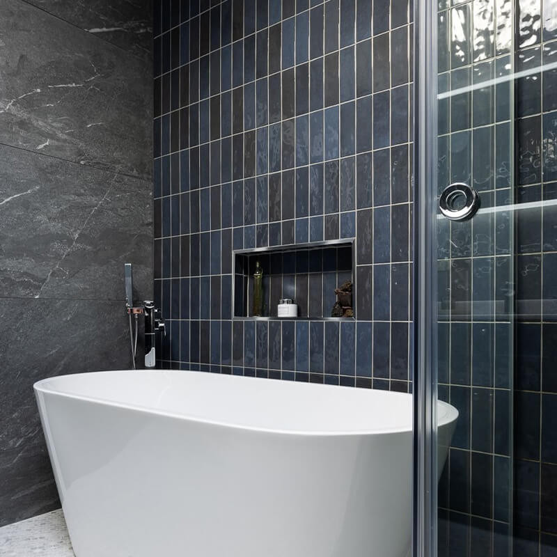 Bright bathroom with reflective glossy tiles