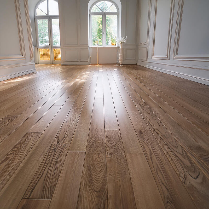 Oak wood flooring with white skirting in a traditional living room