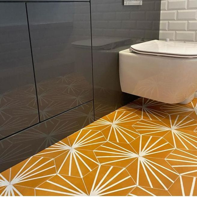 Orange tiles installed in a bathroom