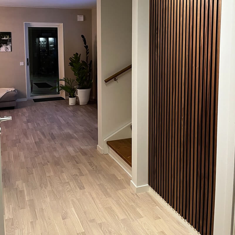 Wall paneling stairs with sleek wooden accents