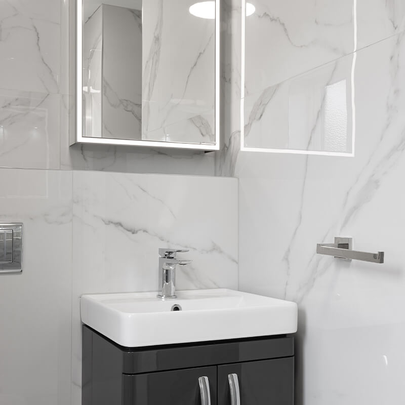 White Marble Tiles Installed on Walls and Floors in a Bathroom in Dublin 